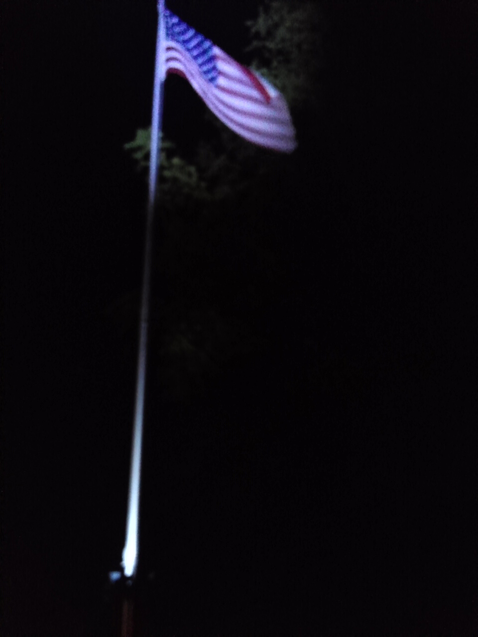 Looking up at flag illuminated by Polepal extreme